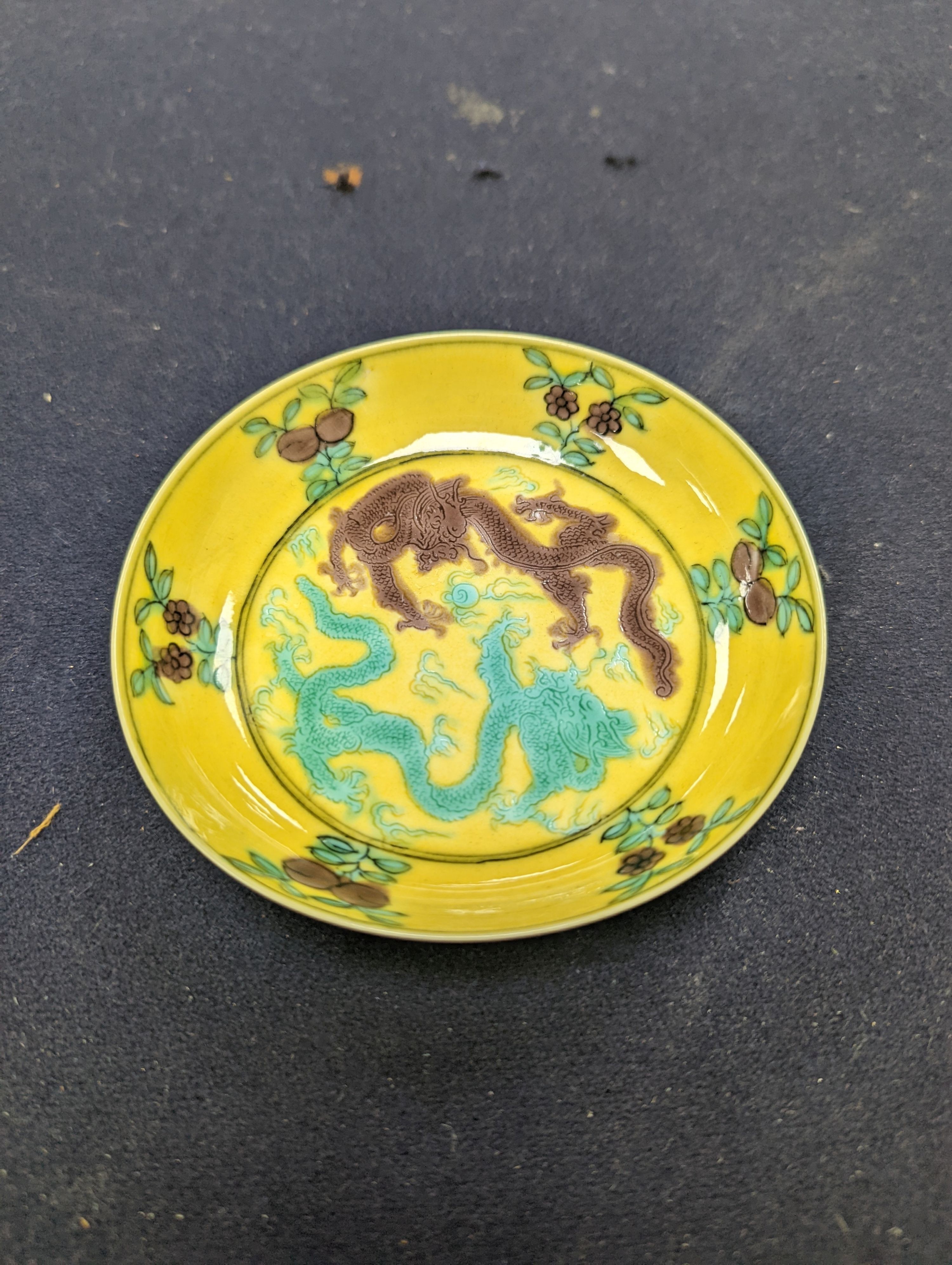 A pair of Chinese yellow, green and aubergine dragon dishes, Guangxu marks, 10cm.